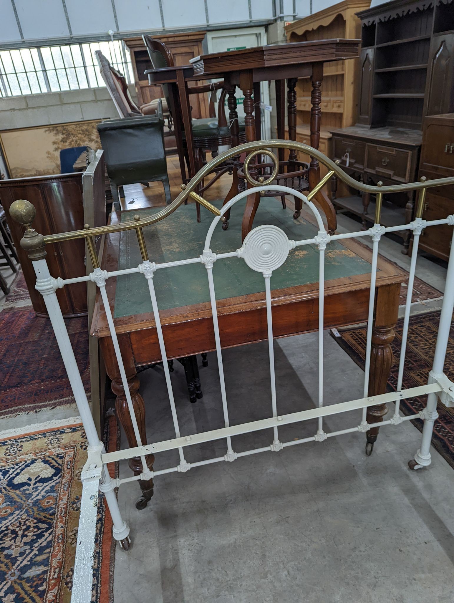 A Victorian painted iron and brass single bedframe, width 120cm, length 200cm